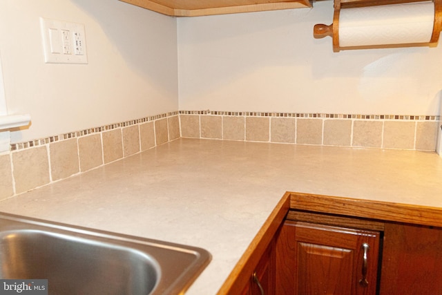 503 Deer Run Rd, Lititz, PA 17543 - detailed view of light countertops, backsplash, and brown cabinetry