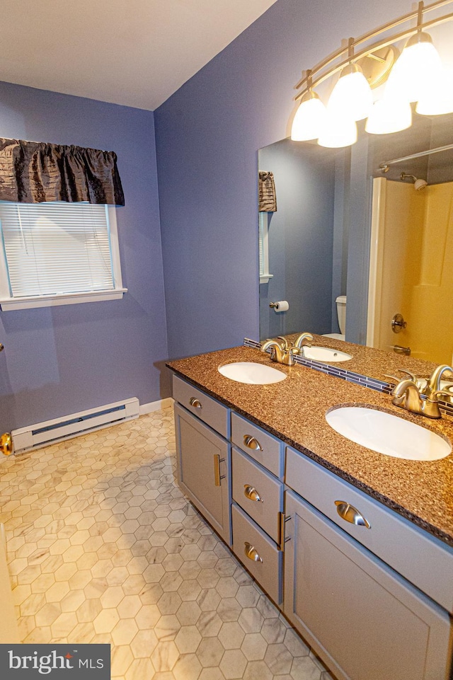 503 Deer Run Rd, Lititz, PA 17543 - bathroom with a baseboard heating unit, double vanity, and toilet