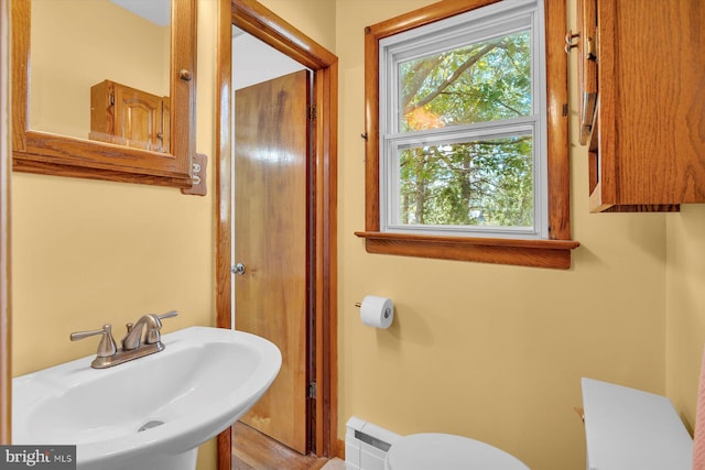 176 Morris Ave, Sewell, NJ 08080 - bathroom with toilet, a sink, and a baseboard radiator