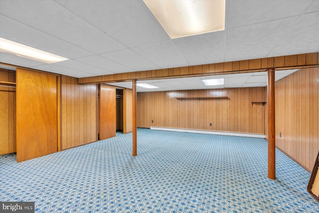 176 Morris Ave, Sewell, NJ 08080 - finished basement featuring a baseboard radiator, wooden walls, a paneled ceiling, and carpet