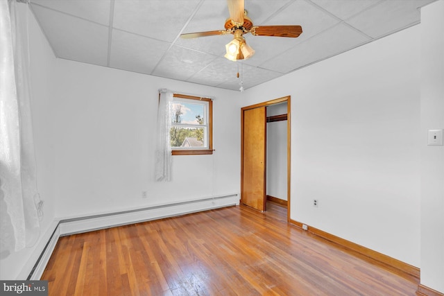 176 Morris Ave, Sewell, NJ 08080 - unfurnished bedroom featuring wood finished floors, baseboards, a paneled ceiling, a closet, and a ceiling fan