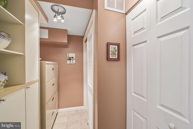 706 6th St SW, Washington, DC 20024 - hallway featuring baseboards and light tile patterned floors