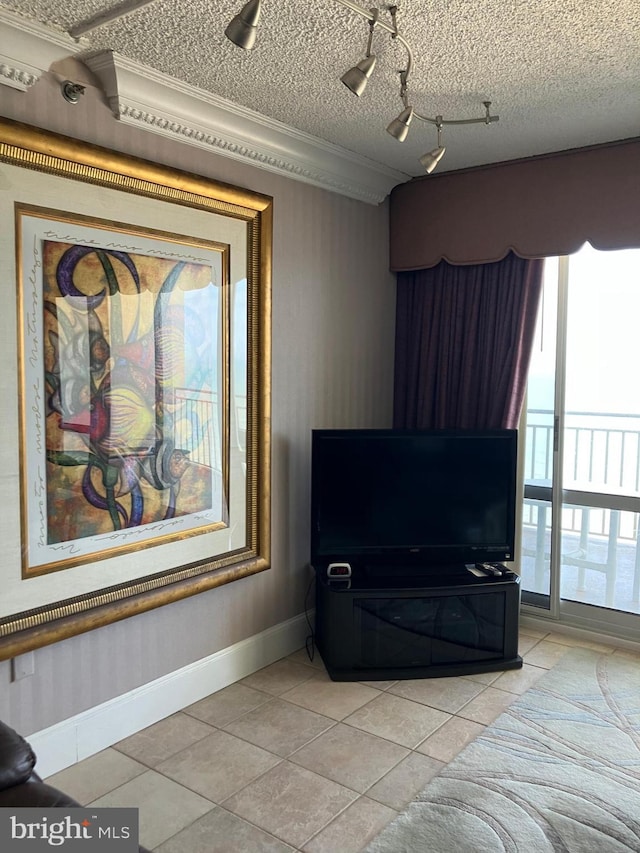 11700 Coastal Hwy Unit 2011, Ocean City, MD 21842 - bedroom featuring baseboards, light tile patterned floors, crown molding, and a textured ceiling