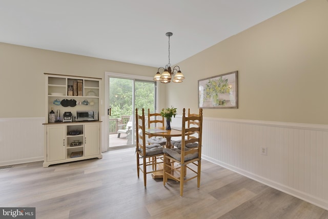 35871 Devon Park Sq, Round Hill, VA 20141 - dining space with wainscoting, a chandelier, and light wood finished floors