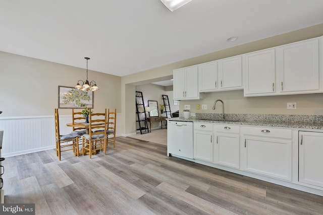 35871 Devon Park Sq, Round Hill, VA 20141 - kitchen featuring dishwasher, a sink, white cabinets, light stone counters, and light wood-style floors