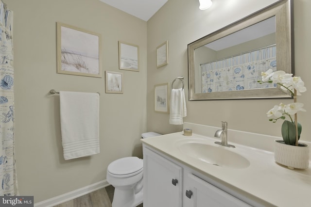 35871 Devon Park Sq, Round Hill, VA 20141 - full bath featuring toilet, vanity, wood finished floors, and baseboards