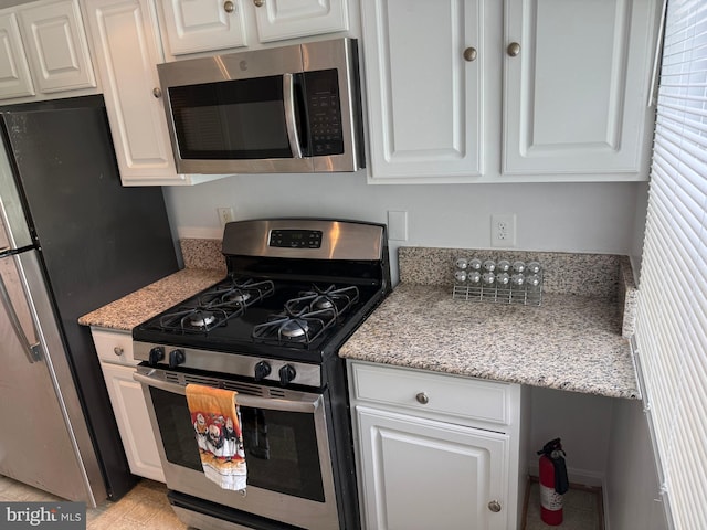 4212 Benning Rd NE Unit 6, Washington, DC 20019 - kitchen featuring appliances with stainless steel finishes and white cabinets