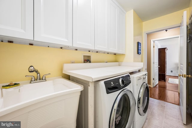 41 Musket Ct, West Chester, PA 19382 - laundry room with cabinet space, separate washer and dryer, and light tile patterned floors
