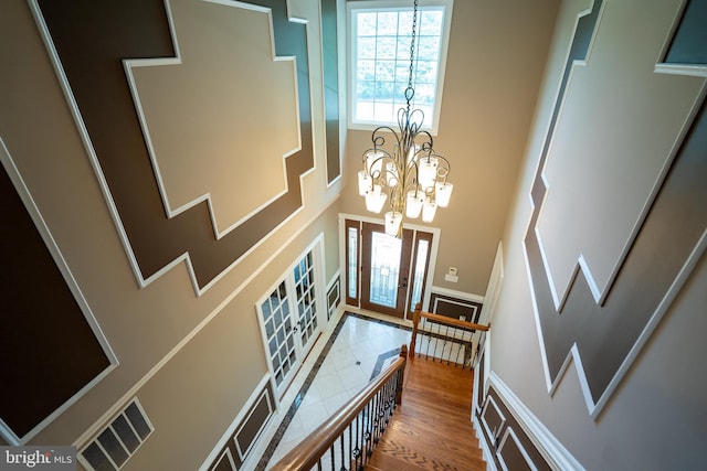 5280 Ten Oaks Rd, Clarksville, MD 21029 - entrance foyer featuring a chandelier, a high ceiling, french doors, and wood finished floors