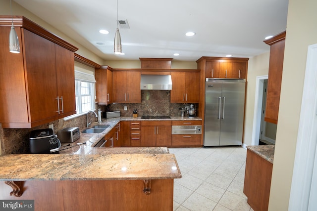 5280 Ten Oaks Rd, Clarksville, MD 21029 - kitchen featuring built in fridge, wall chimney exhaust hood, brown cabinetry, decorative backsplash, and a warming drawer