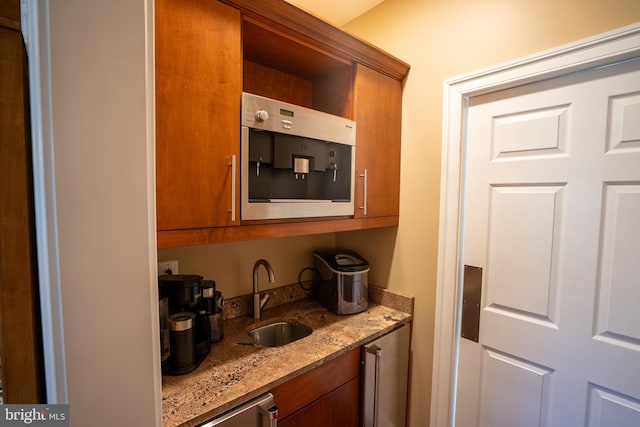 5280 Ten Oaks Rd, Clarksville, MD 21029 - kitchen featuring brown cabinets and light stone counters