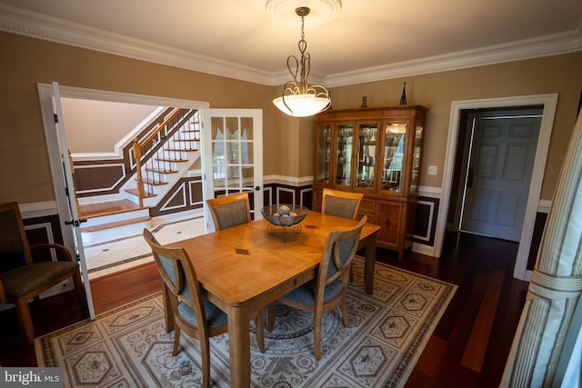 5280 Ten Oaks Rd, Clarksville, MD 21029 - dining space with stairway, ornamental molding, wainscoting, and dark wood-type flooring