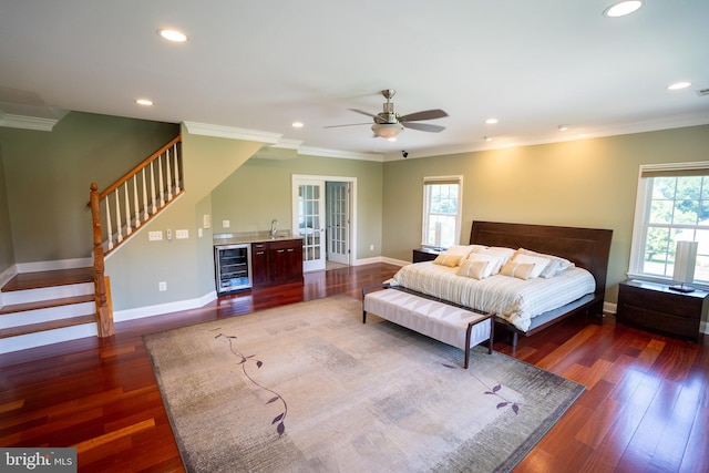 5280 Ten Oaks Rd, Clarksville, MD 21029 - bedroom with wine cooler, multiple windows, recessed lighting, crown molding, and wood finished floors
