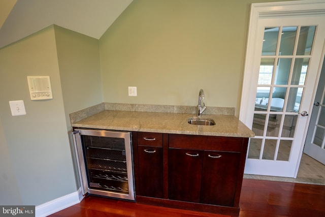5280 Ten Oaks Rd, Clarksville, MD 21029 - bar area with beverage cooler, dark wood-type flooring, and lofted ceiling