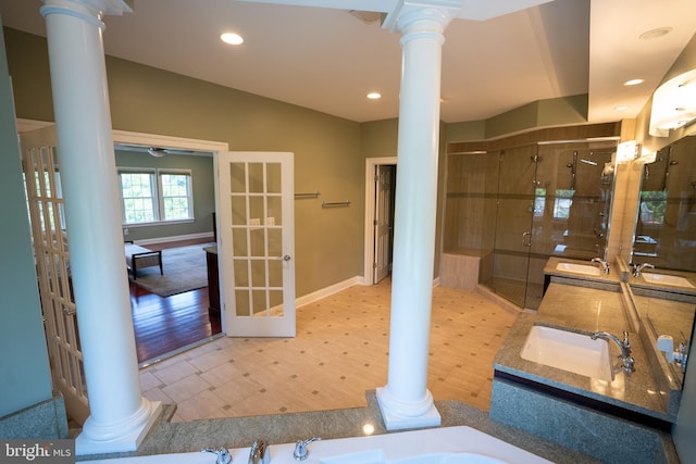 5280 Ten Oaks Rd, Clarksville, MD 21029 - bathroom with decorative columns, a shower stall, double vanity, a garden tub, and recessed lighting