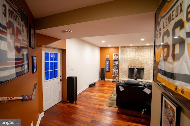5280 Ten Oaks Rd, Clarksville, MD 21029 - living area with wood finished floors, a fireplace, and recessed lighting