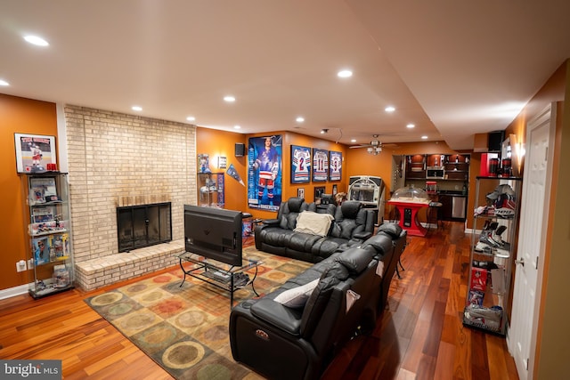 5280 Ten Oaks Rd, Clarksville, MD 21029 - living area featuring a ceiling fan, wood finished floors, recessed lighting, and a brick fireplace