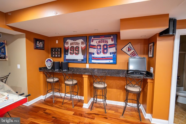 5280 Ten Oaks Rd, Clarksville, MD 21029 - indoor bar featuring wood finished floors and baseboards