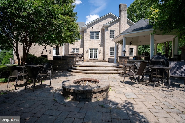 5280 Ten Oaks Rd, Clarksville, MD 21029 - view of patio / terrace with a fire pit, a gazebo, and outdoor dining space