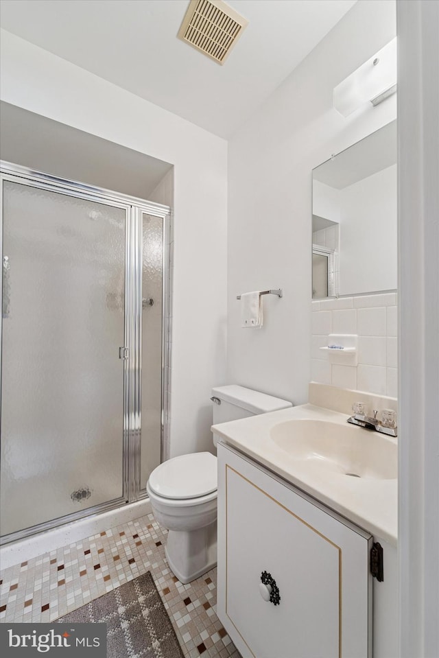 15111 Ina Dr, Philadelphia, PA 19116 - bathroom with vanity, toilet, a shower stall, and tile patterned floors