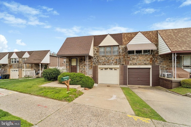 15111 Ina Dr, Philadelphia, PA 19116 - view of front facade with stone siding, concrete driveway, a garage, and a front lawn
