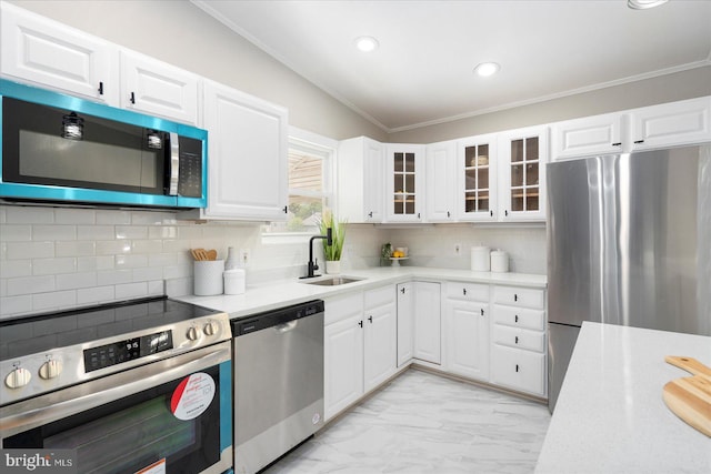 15 Charleswood Ct, Baltimore, MD 21207 - kitchen featuring appliances with stainless steel finishes, a sink, crown molding, light countertops, and glass insert cabinets