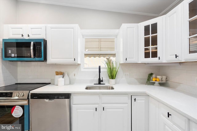 15 Charleswood Ct, Baltimore, MD 21207 - kitchen featuring stainless steel appliances, a sink, white cabinetry, decorative backsplash, and ornamental molding