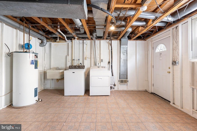 15 Charleswood Ct, Baltimore, MD 21207 - basement with water heater, washer and clothes dryer, and a sink