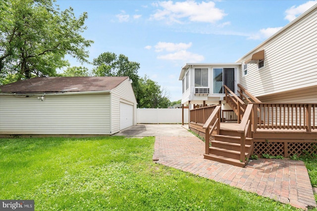 15 Charleswood Ct, Baltimore, MD 21207 - view of yard featuring an outbuilding, a detached garage, stairs, a deck, and a sunroom