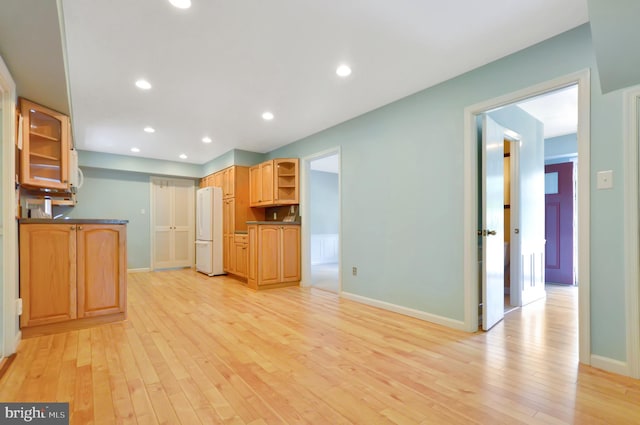 12110 Wilmont Turn, Bowie, MD 20715 - kitchen featuring freestanding refrigerator, light wood-style flooring, open shelves, baseboards, and dark countertops