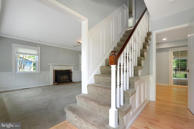 12110 Wilmont Turn, Bowie, MD 20715 - staircase featuring crown molding, a decorative wall, wainscoting, and wood finished floors