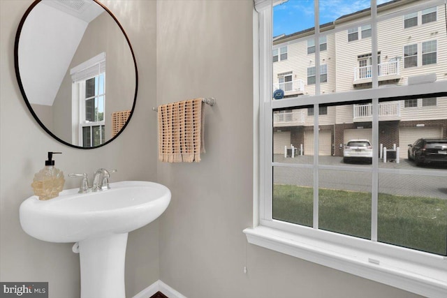 21668 Pattyjean Ter Unit 0, Ashburn, VA 20147 - bathroom featuring healthy amount of natural light, baseboards, and a sink