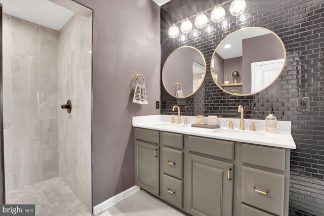 21668 Pattyjean Ter Unit 0, Ashburn, VA 20147 - bathroom featuring double vanity, tile patterned floors, a tile shower, and baseboards