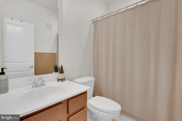 21668 Pattyjean Ter Unit 0, Ashburn, VA 20147 - bathroom featuring toilet, vanity, and a shower with shower curtain