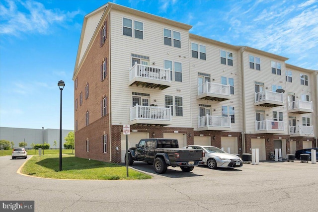 21668 Pattyjean Ter Unit 0, Ashburn, VA 20147 - view of apartment building / complex with a garage