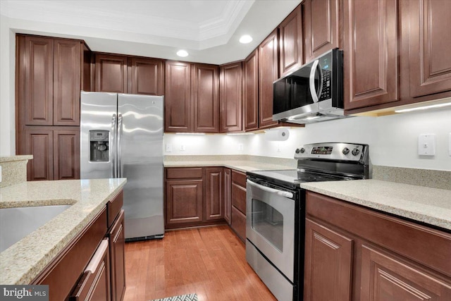 21668 Pattyjean Ter Unit 0, Ashburn, VA 20147 - kitchen featuring appliances with stainless steel finishes, ornamental molding, light wood-style flooring, recessed lighting, and light stone countertops