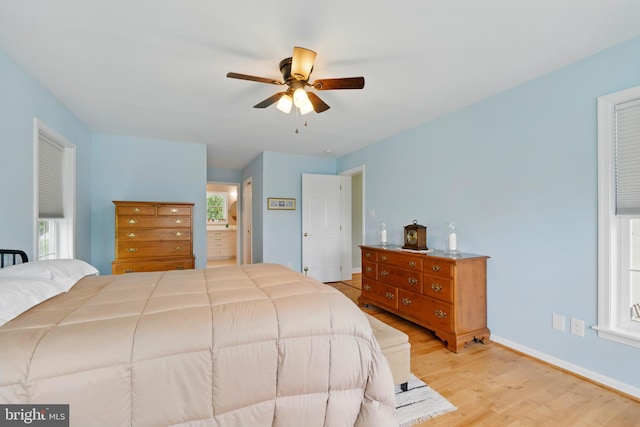 201 Pondview Ct, Chestertown, MD 21620 - bedroom featuring wood finished floors, baseboards, ensuite bathroom, and a ceiling fan