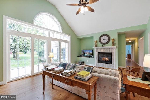 201 Pondview Ct, Chestertown, MD 21620 - living area featuring a ceiling fan, high vaulted ceiling, wood finished floors, and a tiled fireplace