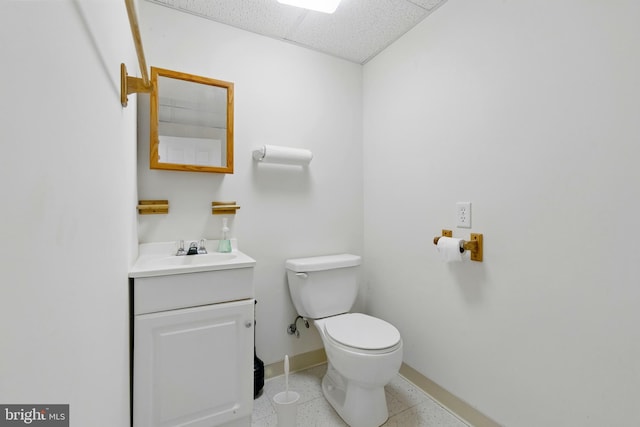 201 Pondview Ct, Chestertown, MD 21620 - half bath featuring toilet, baseboards, vanity, a paneled ceiling, and speckled floor