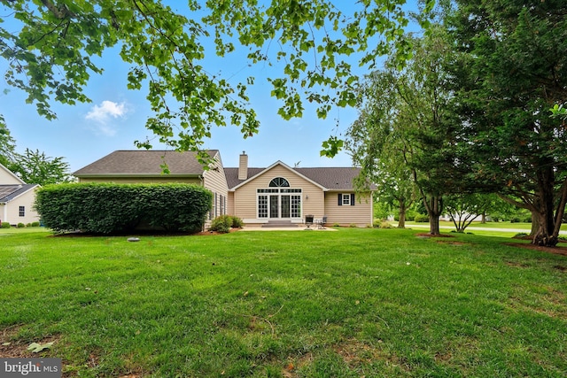 201 Pondview Ct, Chestertown, MD 21620 - rear view of property featuring a yard, a chimney, and a patio area