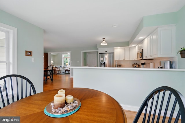 201 Pondview Ct, Chestertown, MD 21620 - dining space featuring light wood finished floors and baseboards