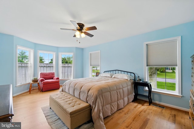 201 Pondview Ct, Chestertown, MD 21620 - bedroom featuring baseboards, light wood-style floors, and multiple windows
