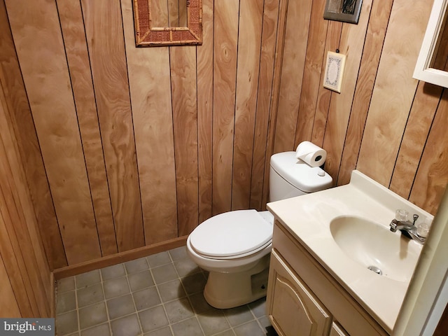 43 Springlake Dr, Newark, DE 19711 - half bathroom featuring wooden walls, tile patterned flooring, and vanity