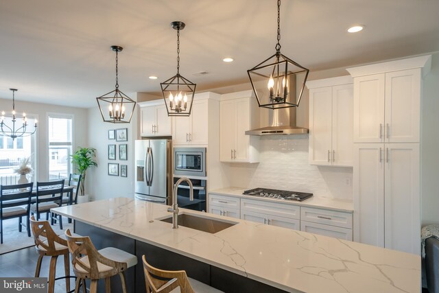 301 Star Tavern Ln, West Chester, PA 19382 - kitchen with appliances with stainless steel finishes, a sink, a chandelier, backsplash, and recessed lighting
