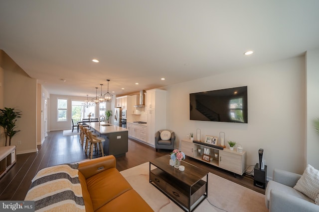 301 Star Tavern Ln, West Chester, PA 19382 - living area with dark wood-style flooring, recessed lighting, a chandelier, and baseboards