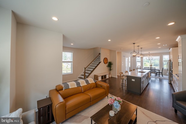 301 Star Tavern Ln, West Chester, PA 19382 - living room featuring recessed lighting, dark wood-style flooring, stairway, and a chandelier