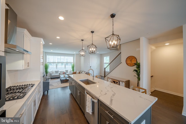 301 Star Tavern Ln, West Chester, PA 19382 - kitchen with wall chimney exhaust hood, stainless steel appliances, a sink, open floor plan, and white cabinets