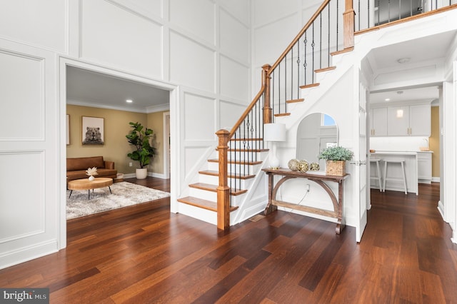 2006 Par Dr, Doylestown, PA 18901 - foyer entrance featuring a decorative wall, stairs, ornamental molding, dark wood finished floors, and a high ceiling