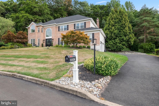 2006 Par Dr, Doylestown, PA 18901 - view of front of property with a chimney, a front yard, and brick siding