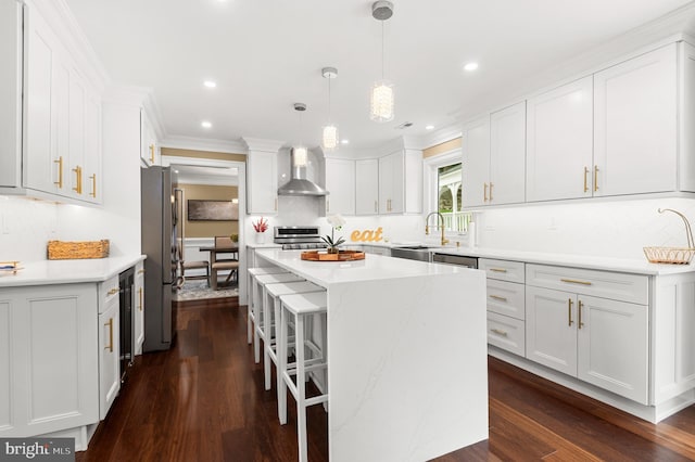 2006 Par Dr, Doylestown, PA 18901 - kitchen featuring wall chimney range hood, a sink, stainless steel appliances, a center island, and white cabinetry